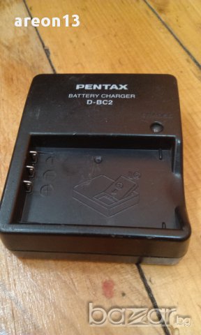 Pentax зарядно, снимка 1 - Батерии, зарядни - 11439758