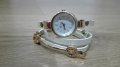 Часовник с камъчета и бяла каишка, усукваща се 2 пъти около китката, снимка 1 - Дамски - 23534331