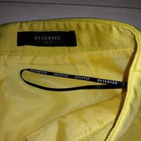 Жълта пола с джобове марка Reserved, снимка 2 - Поли - 24023479