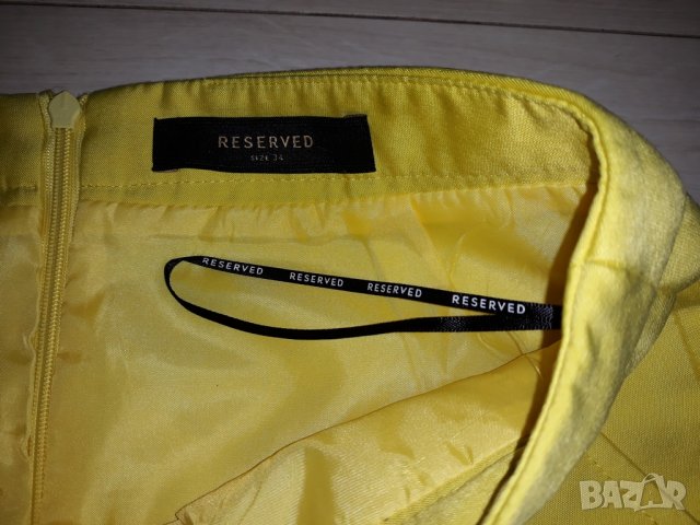 Жълта пола с джобове марка Reserved, снимка 2 - Поли - 24023479