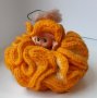 Плетена оранжева кукла