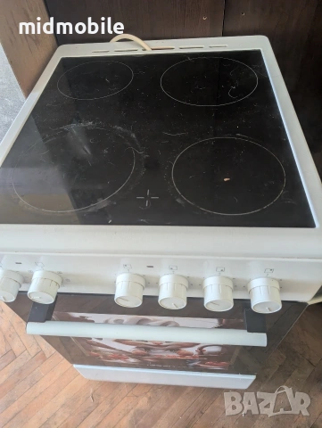 Готварска печка Tesla CV5400SW , снимка 3 - Печки, фурни - 53922582