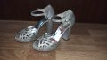 Бални обувки с висок ток в сребрист цвят Kemal Tanca
