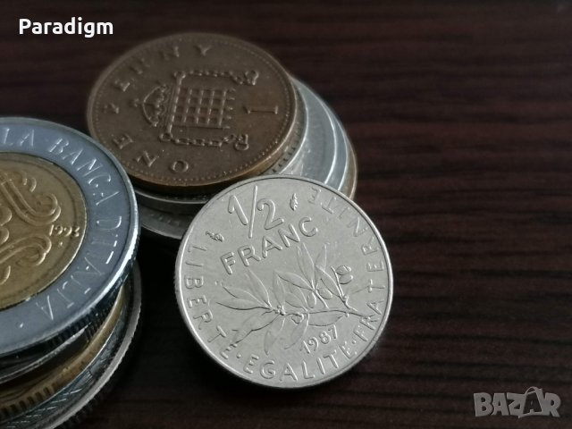 Монета - Франция - 1/2 (половин) франк | 1987г.