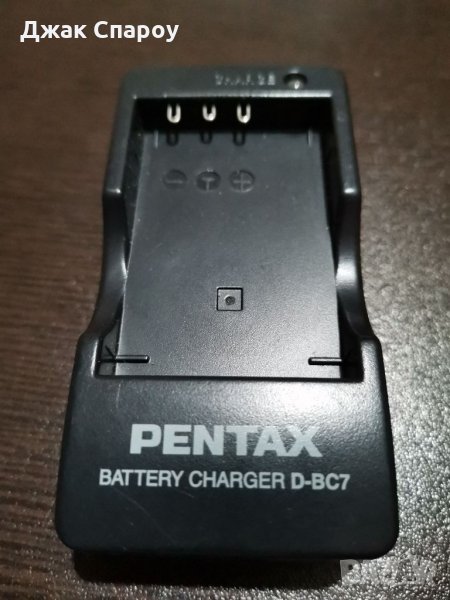 Оригинално зарядно устройство Pentax D-BC7 за батерии Pentax D-Li7, снимка 1