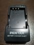 Оригинално зарядно устройство Pentax D-BC7 за батерии Pentax D-Li7
