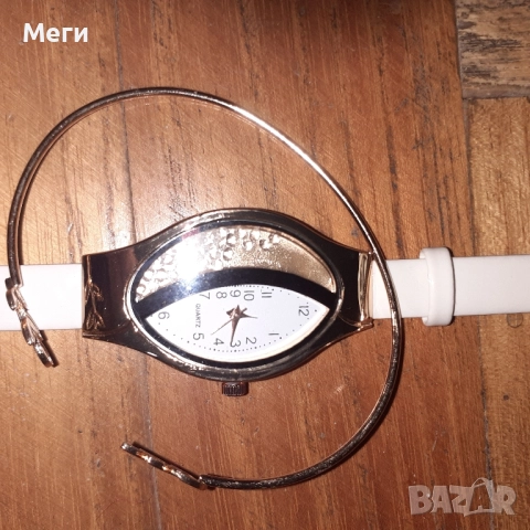 дамски часовник,с украсяважа го допълнителна гривна,с двшжещи се камьчета, снимка 2 - Чанти - 52501275