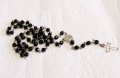 Броеница, сребърна католическа молитвена броеница със черни бляскави фасетирани оникси Светеца Шарбе