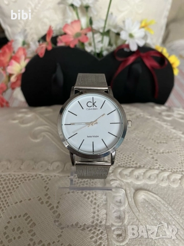 Часовници Calvin Klein , снимка 12 - Дамски - 52545572