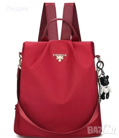 Нова дамска текстилна раница в червен цвят с висулка 
