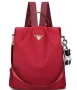 Нова дамска текстилна раница в червен цвят с висулка , снимка 1
