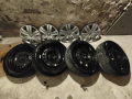 Оригинални стоманени джанти с тасове и зимни гуми за VW, снимка 1 - Гуми и джанти - 44809435
