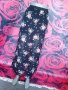 Черна шифон пола с флорални мотиви и цепки С, снимка 1 - Поли - 37616040
