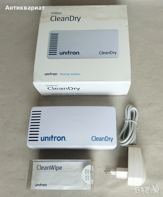 Уред за сухо почистване на слухови апарати и слушалки за поставяне в ушите с UV облъчване UNITRON, снимка 1