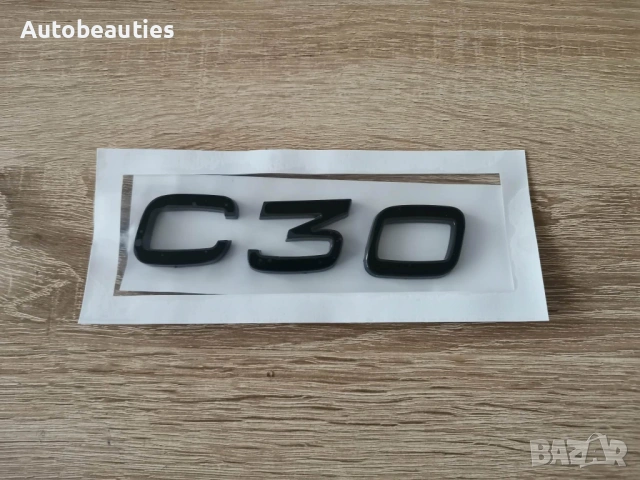 черна емблемa Volvo C30