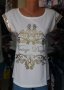 УНИКАЛНО КРАСИВА бяла блуза със златиста щампа и златисти пайети по ръкавите , снимка 1 - Тениски - 42110177