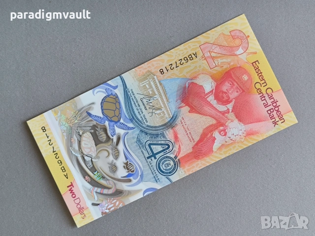 Банкнота - Източни Кариби - 2 долара (юбилейна) UNC | 2023г.