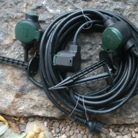 Rev Германия , Удължител с гумен захранващ кабел, 3-посочен , 10 м, ултра гъвкав , черен с зелено IP, снимка 1 - Други - 31145907
