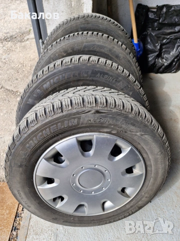 Зимни гуми Мишлен 195/65R15 с железни джанти и тасове за Пежо