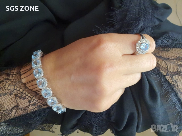 СРЕБЪРНА ГРИВНА ОТ ТАЙЛАНД С НЕБЕСНОСИН ТОПАЗ И РОДИЕВО ПОКРИТИЕ