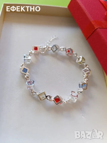 Нова, масивна сребърна гривна с разноцветни кристали, в подаръчна кутия.