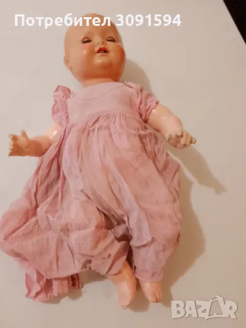 Стара бисквитена кукла с отворена уста и мигащи очи, 