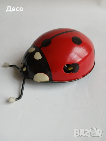 Стара руска тенекиена играчка калинка.