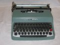 Продавам портативна пишеща машина  Olivetti Lettera 22, снимка 1 - Друго - 38975306