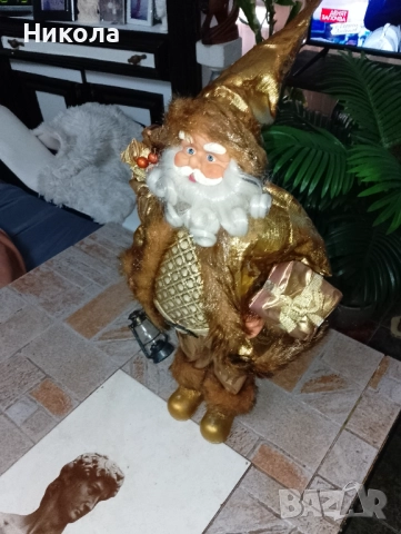 Дядо Коледа в златни одежди,слон от абанос-4кг.