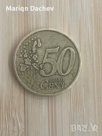 Това е гръцка монета от 50 евроцента от 2002 г., на която е изобразен профилът на Елефтериос Венизел