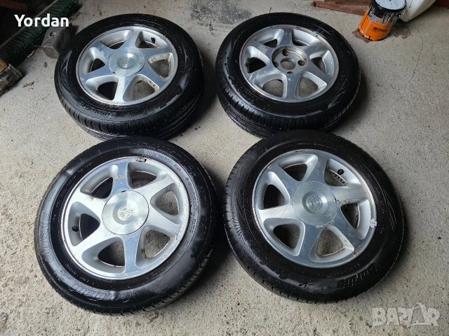 Лети джанти "15" 4х114 с нови гуми 185/65/15 Нисан Nissan, снимка 2 - Гуми и джанти - 52437450