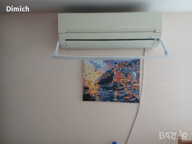 Красив морски пейзаж – Картина на крайбрежен град при залез