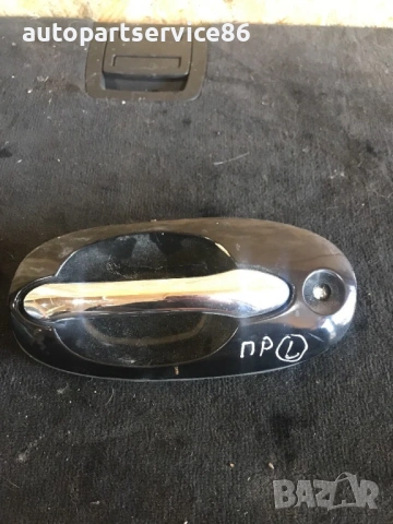 Външна дръжка на предната лява врата (черна) за KIA Carnival 2.9 CRDi (2002–2007) K53A59410