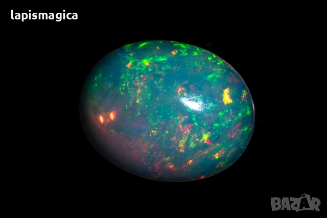 Етиопски опал 0.88ct 9x7mm овален кабошон, снимка 2 - Други - 52135204