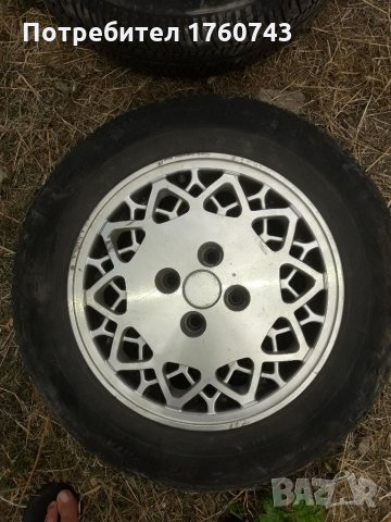 2 бр. Лети джанти 14 ц.4/100 центр отвор 61ммРЕНО Оригинални с гуми  DEBICA  185/65 /14