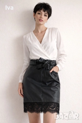 Елегантна черна кожена пола с висока талия, колан и дантелен акцент