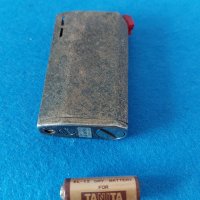 Рядка, посребрена, за колекционери запалка Tanita-04 с оргиналната си батерия, снимка 1 - Запалки - 35272385