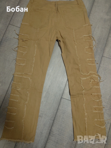 Нови уникални накъсани дънки хл размер , снимка 2 - Дънки - 54314109