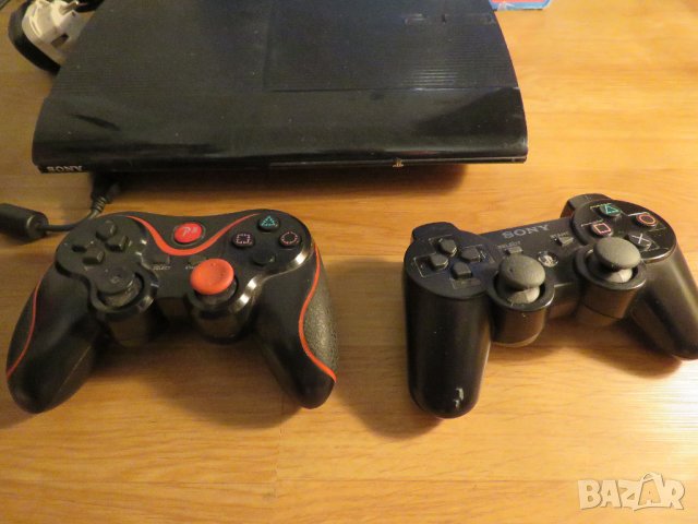 Конзола PS3 - 500GB с два джойстика и 21 игри за любителите на оръжията, колите и приключенията, снимка 2 - PlayStation конзоли - 34918977