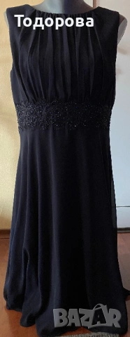 Тъмносиня рокля без ръкав, шифон, с подплата.