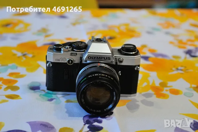Nikon EM Olympus OM-10