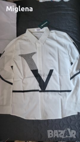 Мъжка риза по етикет размер XL, но по скоро отговаря на  L.