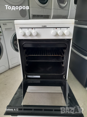Готварска печка AEG, INOX с керамичен плот и фурна с вентилатор 50 см шир., снимка 3 - Печки, фурни - 44808536