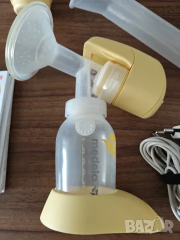 Електрическа помпа за кърма Medela Mini Electric, снимка 2 - Помпи за кърма - 55872484